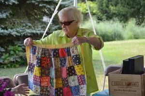 10514734_790403827657236_7111211729005349988_n Margaret Bond shows off the quilted apron made for her by her grandmother Lizzy
